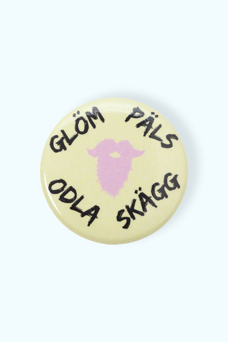 Gul pin med texten "Glöm päls odla skägg"