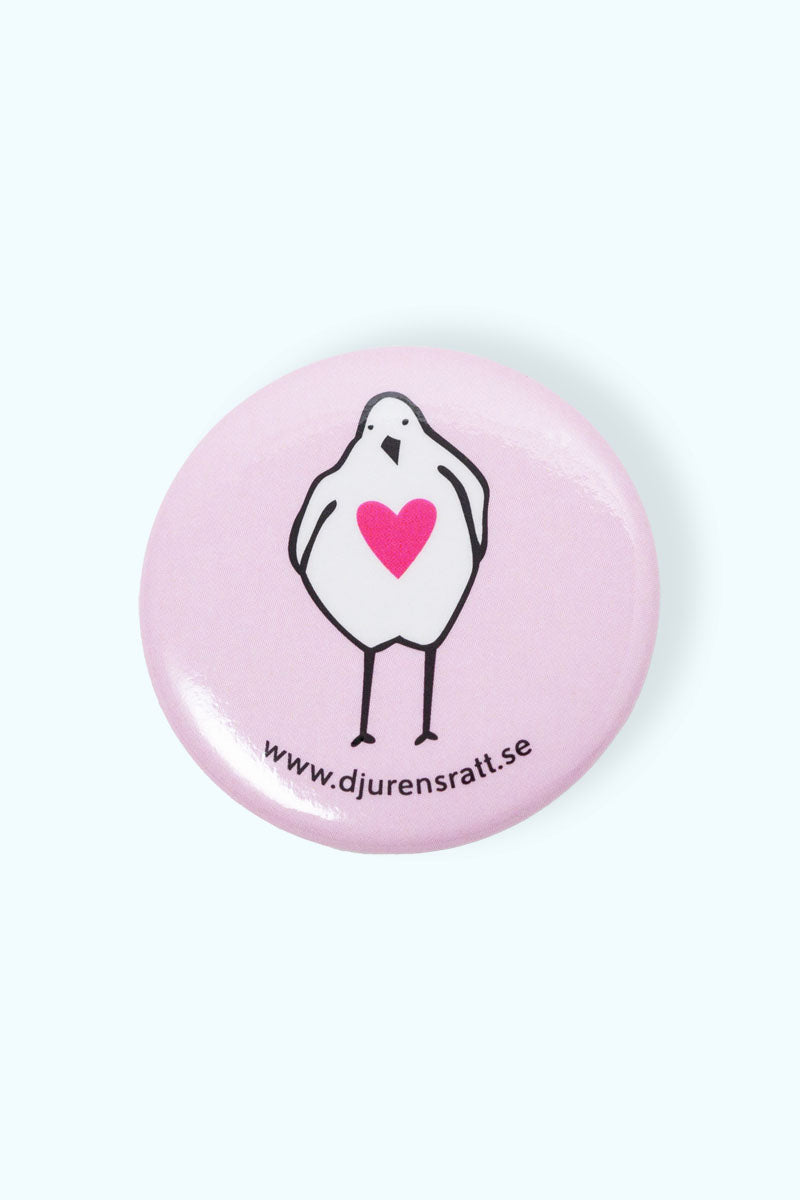 Rosa pin med illustration av en kyckling