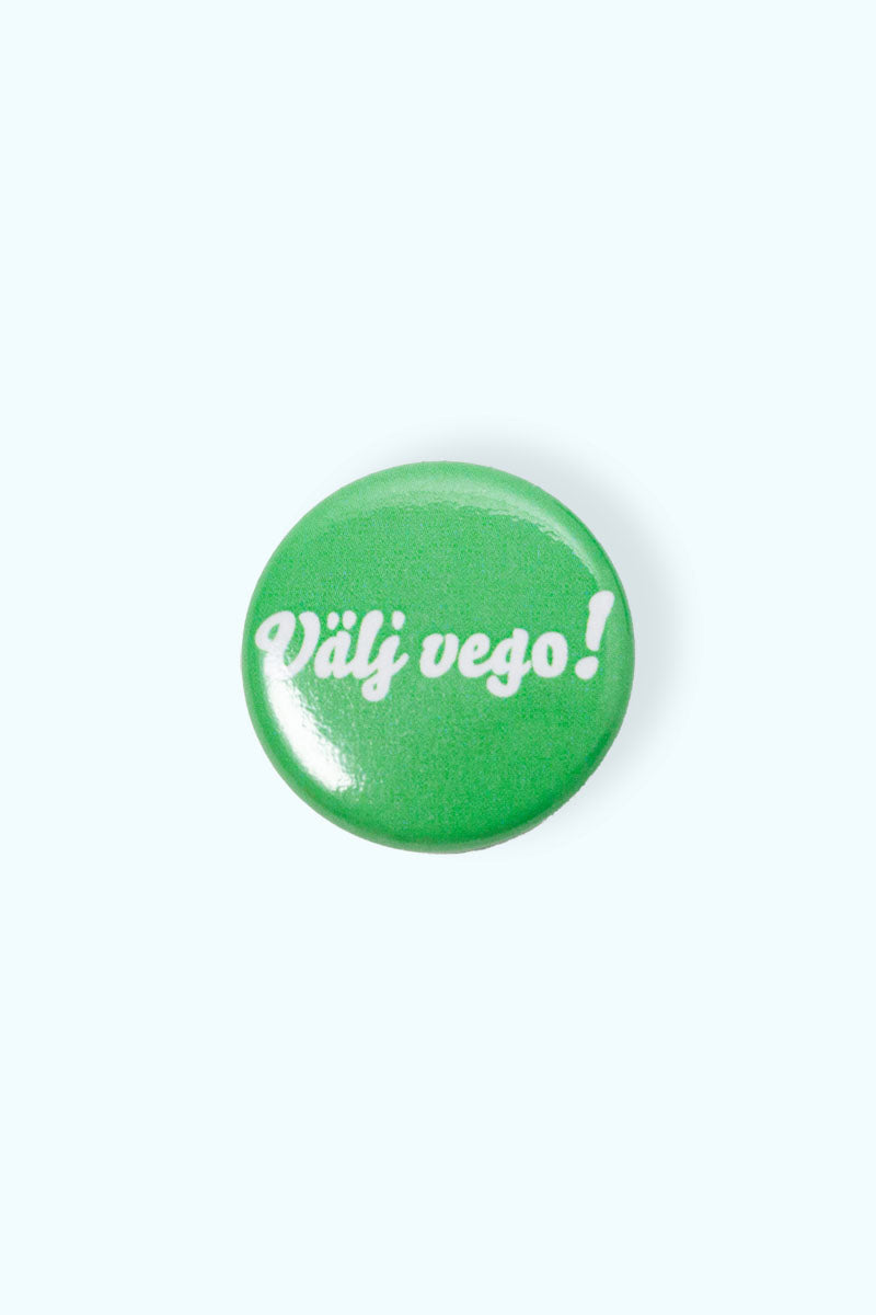 Grön liten pin med texten Välj vego!